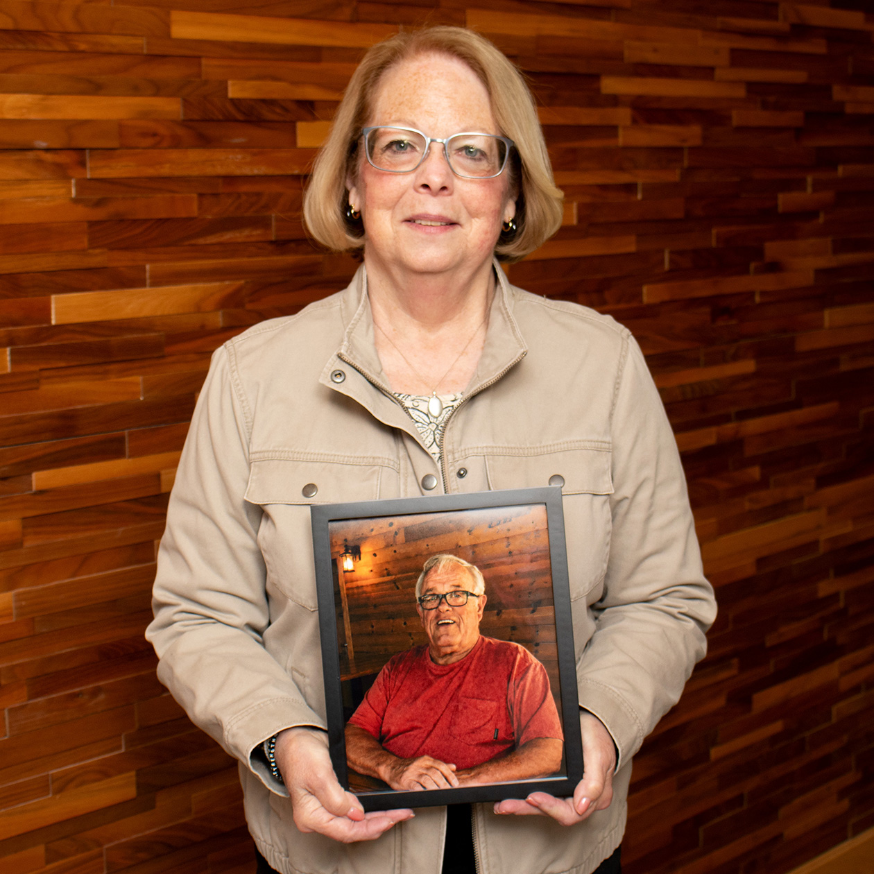 Deb Peyton with Framed Picture of Mike_website